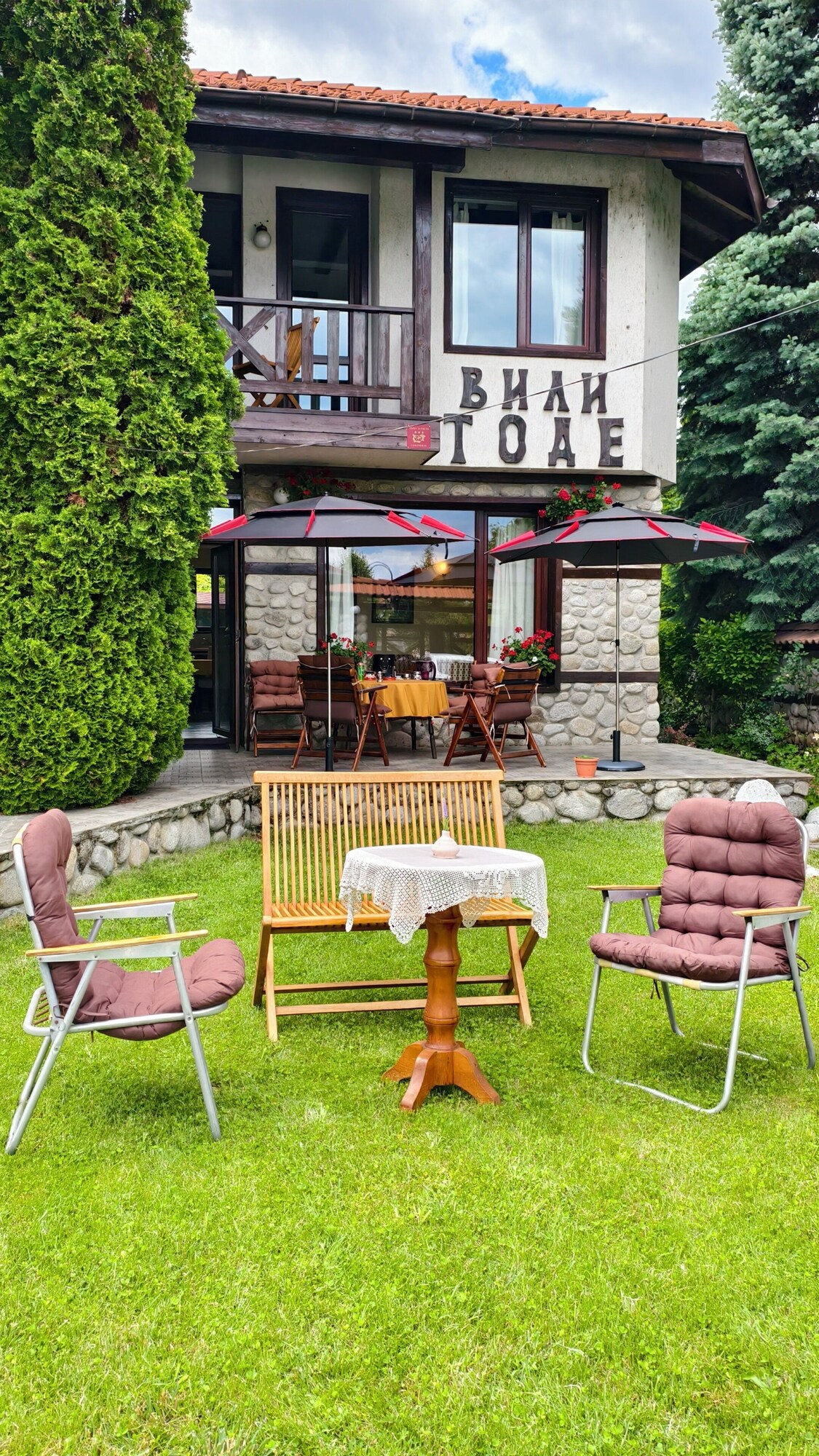 Villa exterior with garden seating
