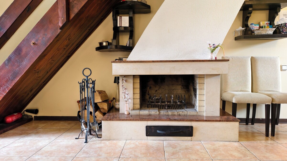 Real fireplace inside Premium Villa Tode